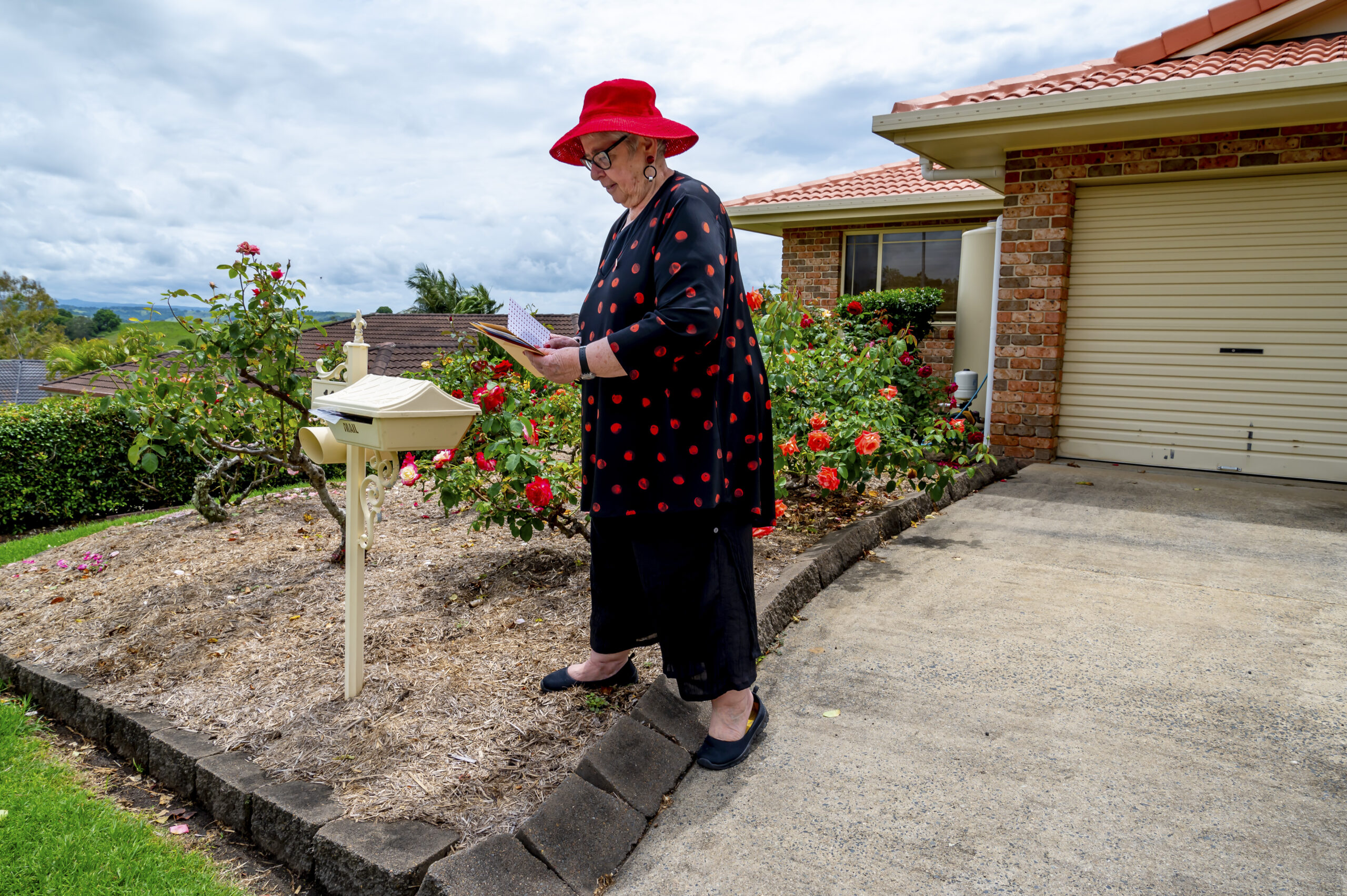Older lady grabbing mail